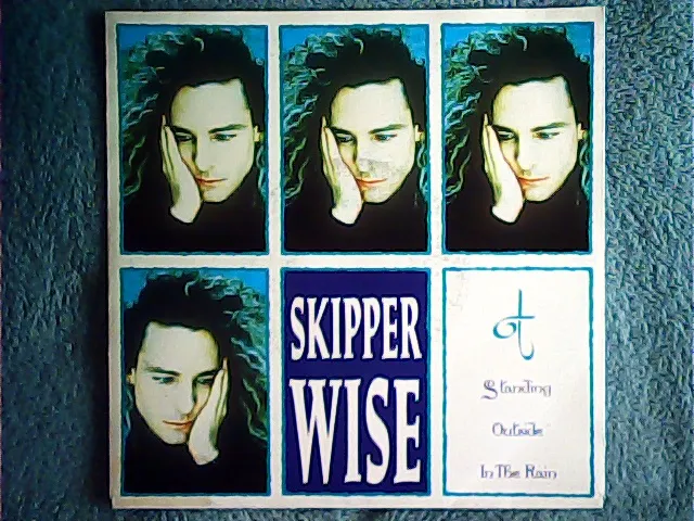 [MV-009943] Skipper Wise - Standing Outside In The Rain